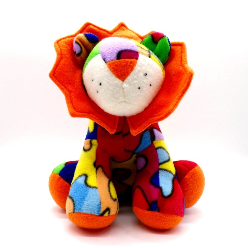Lion Cub Stuffed Animal Plush Bright Colorful Puzzle Piece Pattern Orange Mane